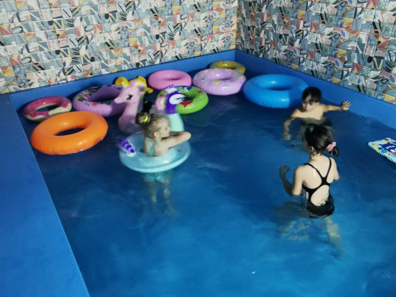 Party at a children's playground with heated pool