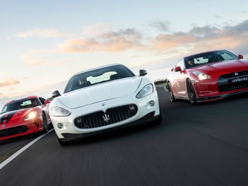 Speeding around the track in two super cars in Hertfordshire, UK