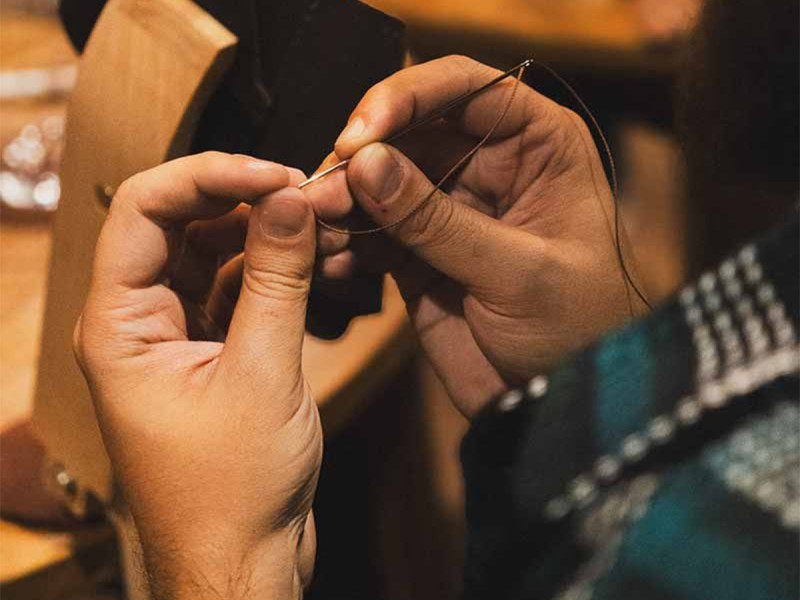 Sewing workshop of natural leather wallets for corporations in Bucharest